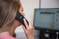 person using telephone